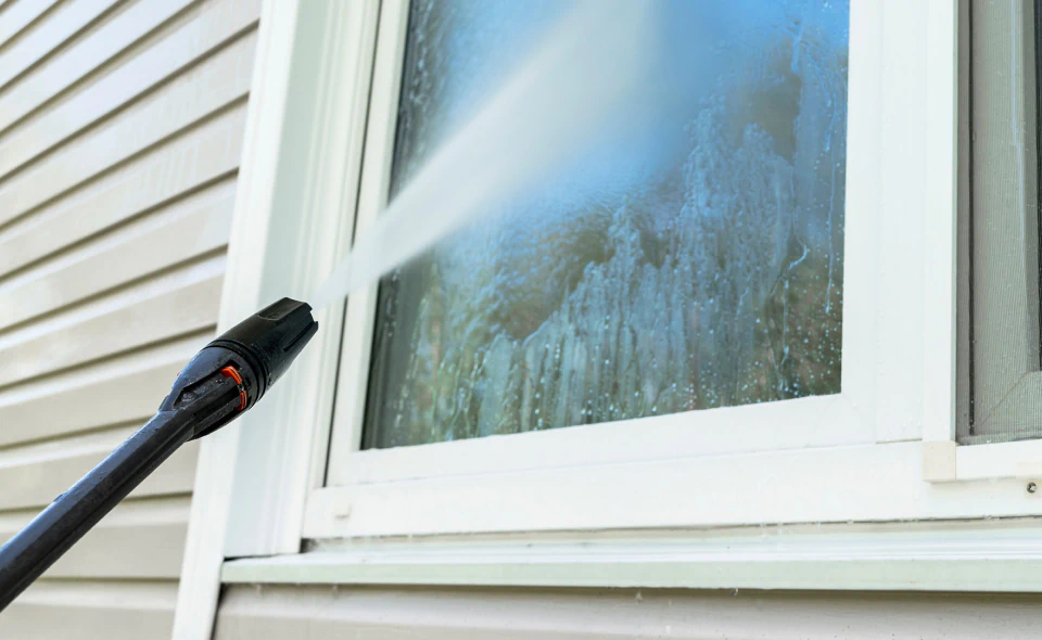 pressure washer cleaning window